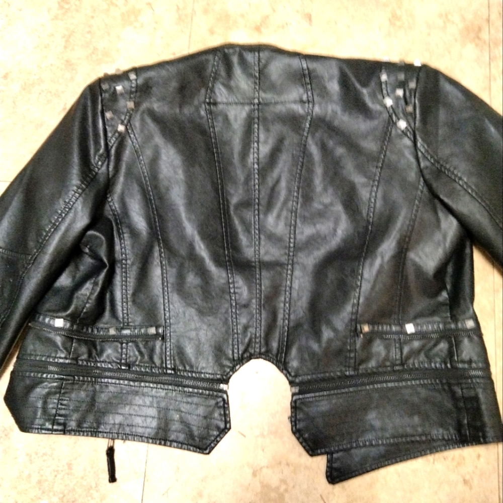 Black leather jacket with spikes on the shoulder and on the wrist part